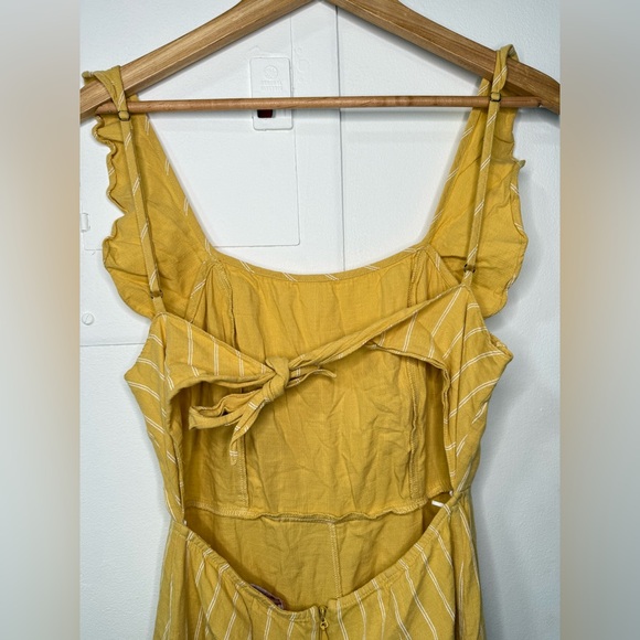 Yellow pinstripe tie back jumpsuit with front ruffle & adjustable straps. Size M - Picture 6 of 8